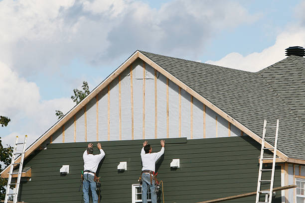 Professional Storm Damage Siding Repair technician working in Eure, NC